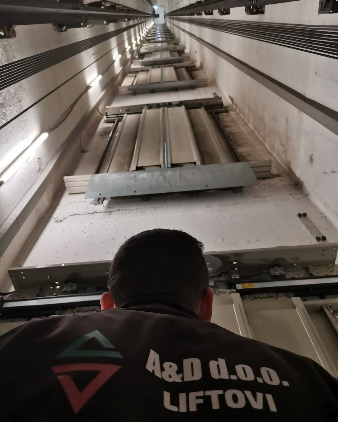 men looking at elevator